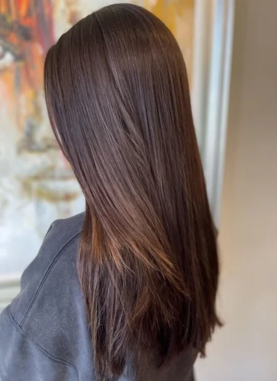 Woman with freshly cut and styled straight brown hair
